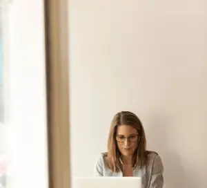 Woman on a laptop working at a desk