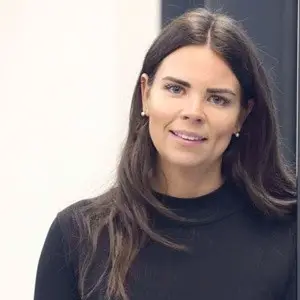 Woman with dark long hair posing for a photo