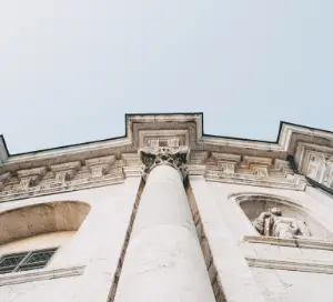 Upscale view of a white building and blue sky