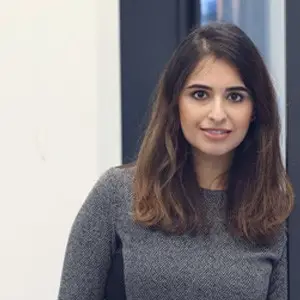shaheen-suri-employee Woman with dark hair posing for a corporate photo