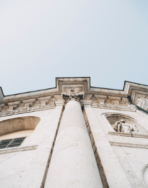 Upscale view of a white building and blue sky
